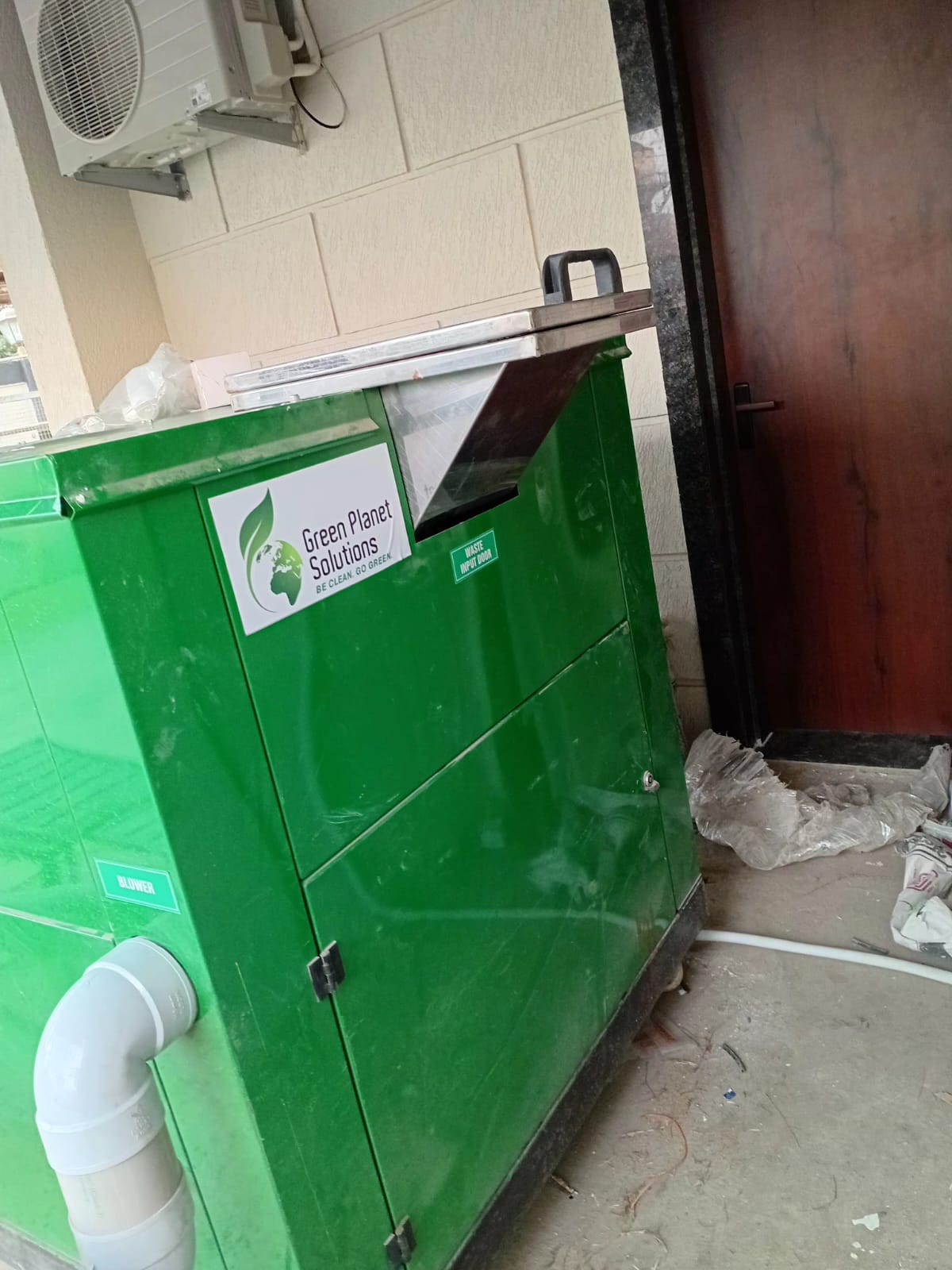 Ergonomic stainless-steel waste input hopper door