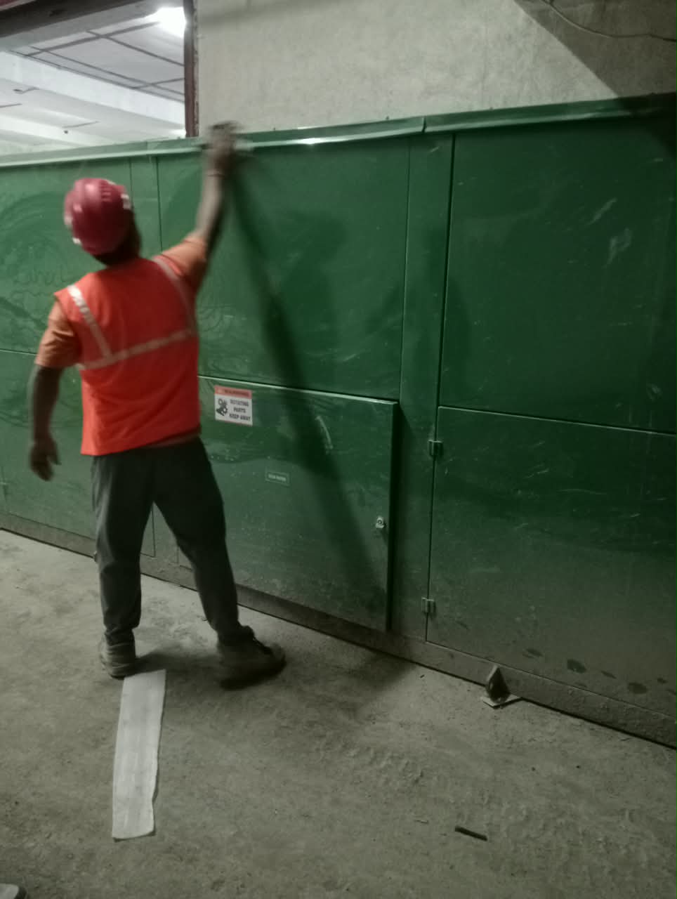 Site engineer inspecting and completing finishing touches on the composter at Solitaire World Pune